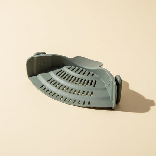 SwiftFix Silicone Clip-On Pot Strainer on a cream studio background
