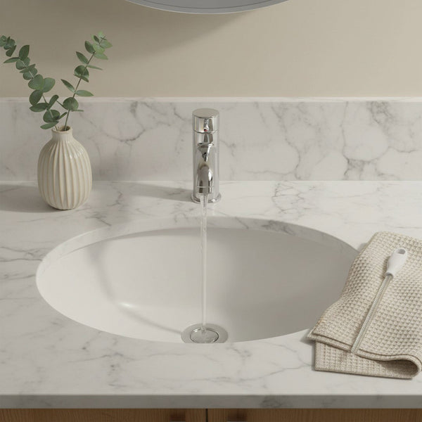 Bathroom sink with murky standing water unable to drain due to a hair clog